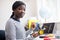 Portrait Of Female Teenage Pupil Building Robot Car In Science Lesson