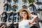 Portrait of female tourist with Casa Batllo by Antoni Gaudi in background