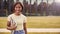 Portrait Of Female University Or College Student Standing By Modern Campus Building