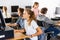 Portrait of a fifteen-year-old schoolgirl studying at a computer