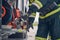 Portrait of firefighter wearing protective gloves working on fire engine