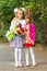 Portrait first grader and her younger sister on way to school