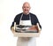 Portrait of a fishmonger with a box with seafood on white background