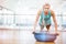 Portrait of fit woman doing push up on bosu ball