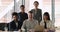 Portrait of five multiethnic ambitious startuppers pose in modern office