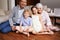 Portrait, floor and happy grandparents with children, sit and smiling together in retirement family home. Senior grandma