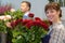 portrait florist holding bouquet roses