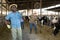 Portrait of a focused african american man standing on a cattle farm with a shovel