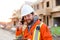 Portrait of foreman talking by smartphone on construction site.