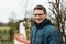 Portrait of a forty year old handsome man with glasses posing at the Belgian countryside