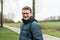 Portrait of a forty year old handsome man with glasses posing at the Belgian countryside