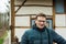 Portrait of a forty year old handsome man with glasses posing at the Belgian countryside