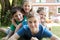 Portrait Of Four Brothers And Sisters Lying In Garden At Home