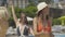 Portrait of four cheerful Caucasian women having fun at poolside at summer resort. Middle shot of happy confident