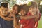 Portrait Of Four Children Having Fun Outdoors Together