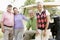 Portrait Of Four Friends Enjoying A Game Golf