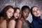 Portrait of four girls with different skin color and nationality.