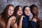 Portrait of four girls with different skin color and nationality in the studio