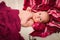 Portrait of four month caucasian baby on knitted plaid in selective focus