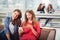 Portrait of four teenager girls sitting at the table in the cafe