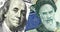 Portrait of Franklin on banknote american dollars and Ayatollah Khomeini on Iranian rials