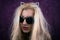 Portrait of freaky blonde girl in sunglasses