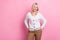 Portrait of friendly positive pleasant retired person wear white sweater look at promotion empty space isolated on pink