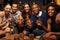 Portrait Of Friends Enjoying Night Out At Rooftop Bar