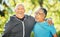 Portrait, friends and senior men in fitness hug at park outdoor after exercise, workout or training together for healthy