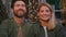 Portrait front view closeup funny two people smiling toothy Caucasian married couple happy 40s spouses bearded husband