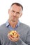 Portrait, fruit salad and unhappy with a mature man in studio isolated on a white background for health eating. Face