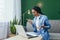 Portrait of frustrated and upset woman at home, Hispanic woman working remotely looking at laptop at work and video call