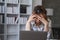 Portrait of frustrated worried young Asian girl looks at laptop upset by bad news, negative bullying message, troubled