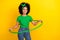 Portrait of funky cute person toothy smile practicing hula hoop empty space isolated on yellow color background