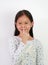 Portrait of funny Asian girl child with expression pig face and hand on white background. Amusing playful child piggy