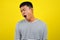 Portrait of funny Asian man yawning covering open mouth and showing a sleepy gesture. feeling being tired from hard work, isolated