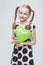 Portrait of Funny Caucasian Blond Girl With Pigtails Posing in Polka Dot Dress