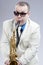 Portrait of Funny Caucasian Saxophone Player in Sunglasses