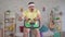 Portrait funny energetic man athlete from the 80`s with a mustache engaged at home on a exercise bike slow mo