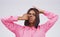 Portrait, funny face and nose with an indian woman in studio on a gray background looking silly or goofy. Comedy, comic