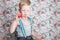 Portrait of funny little boy blowing soap bubbles ( Portrait of funny little boy blowing soap bubbles. Background: floral, soft,