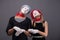 Portrait of funny mime couple with white faces and