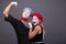 Portrait of funny mime couple with white faces and