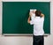 Portrait of funny pupil. School boy very emotional, having fun and very happy, blackboard background - back to school and
