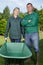 Portrait gardening team with wheelbarrow