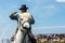 Portrait of a gardian and a camargue horse into the sea