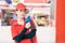 Portrait gas station staff worker women happy smiling with fuel nozzle for car gasoline refill service job