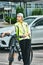 Portrait of a girl on bicycle in an emergency vest