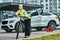 Portrait of a girl on bicycle in an emergency vest