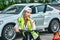 Portrait of a girl on bicycle in an emergency vest